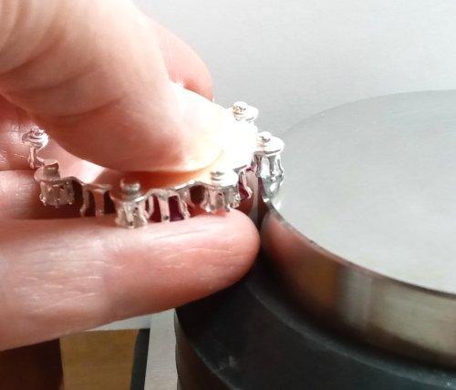 Judy Larson's CZ Explosion Necklace - , Holiday Designs, Cutting, Cutting Tool, Cutters, Filing, Finishing, How To Punch Holes, Hole Punching, Punch A Hole, Tumbling, Tumble, Tumbling Jewelry, Butane Torch, Soldering, Solder, Design, Drilling, Drill, Keeping the snapset level to the bench block 